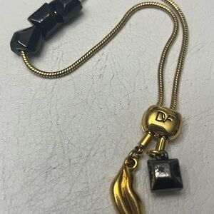 Gold and Black Necklace with Charms